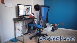 BARTLETT, ILLINOIS - MAY 01: Seven-year-old Hamza Haqqani, a 2nd grade student at Al-Huda Academy, uses a computer to participate in an E-learning class with his teacher and classmates while at his home on May 01, 2020 in Bartlett, Illinois. Al-Huda Academy, an Islam based private school that teaches pre-school through the 6th grade students, has had to adopt an E-learning program to finish the school year after all schools in the state were forced to cancel classes in an attempt to curtail the spread of the COVID-19 pandemic.  (Photo by Scott Olson/Getty Images)